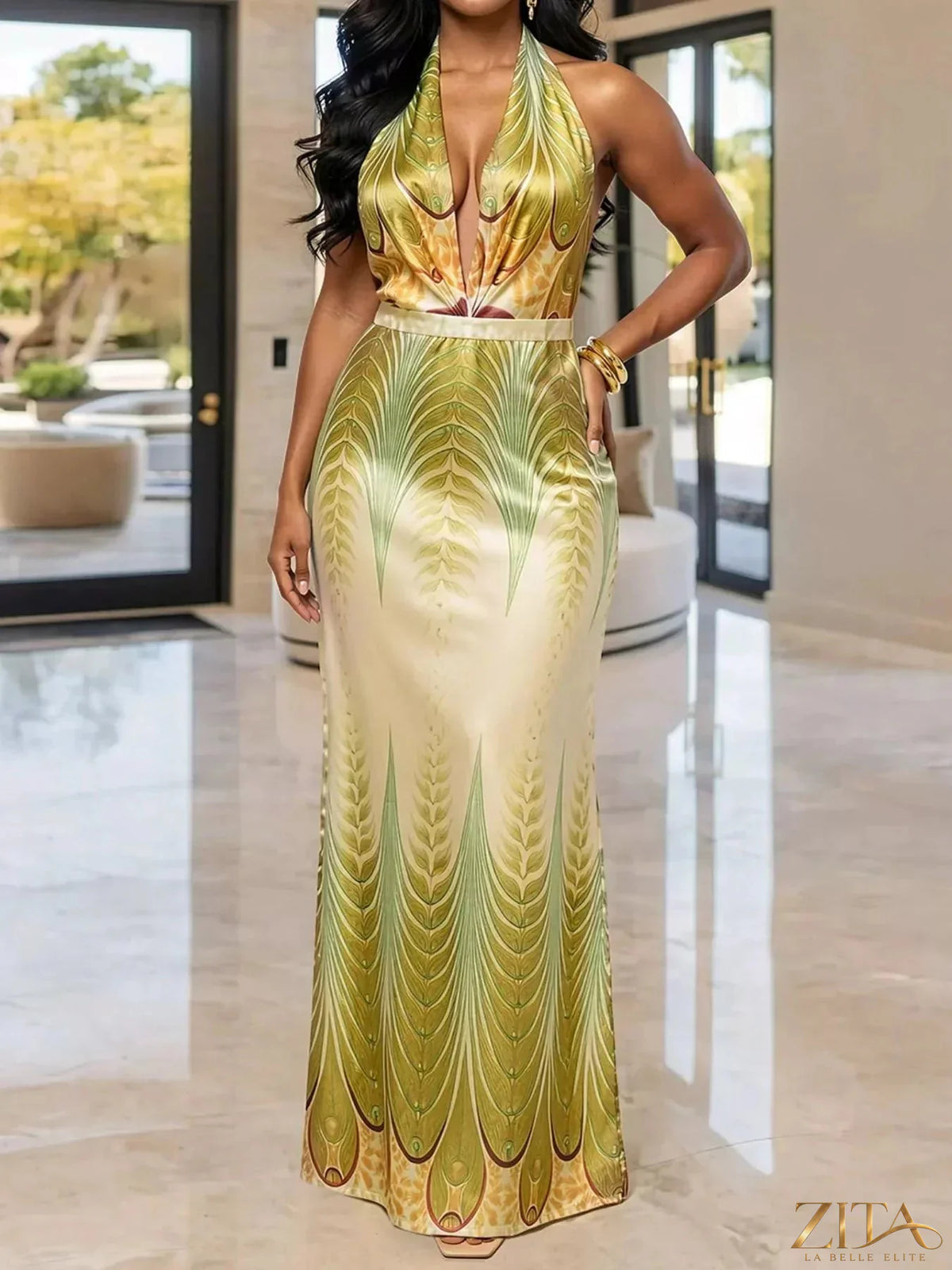 Elegant Zita La Belle Elite halter neck maxi dress with a gradient leaf print, flowing and stylish for formal occasions.