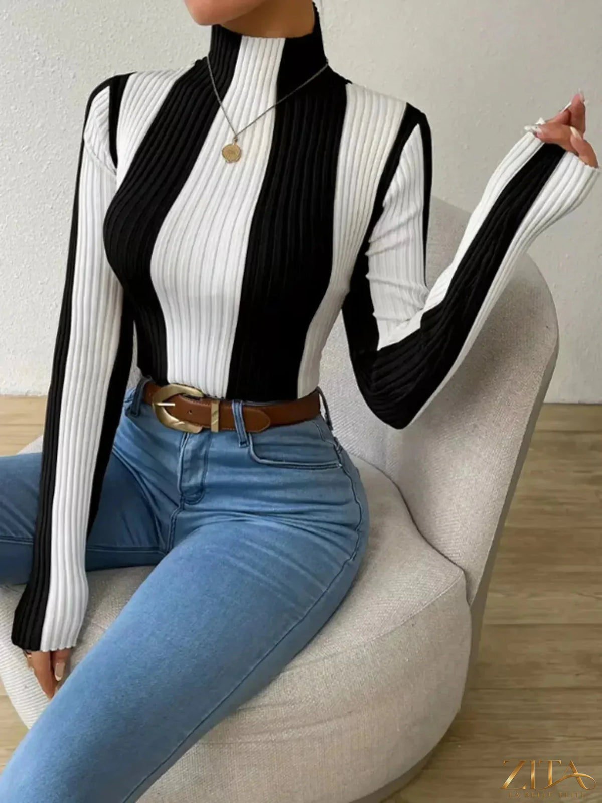 Color block turtleneck ribbed knit top by Trendsi, featuring vibrant color blocks and a high neckline with textured knit fabric.