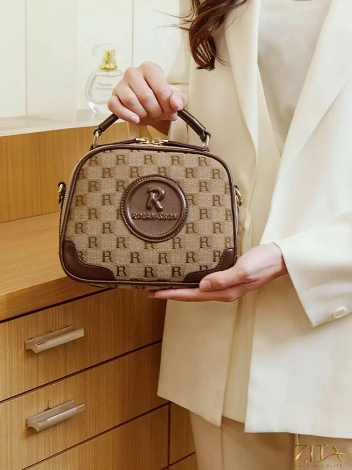 Zita La Belle Elite monogram pattern crossbody handbag with top handle, featuring a sleek design and elegant craftsmanship.