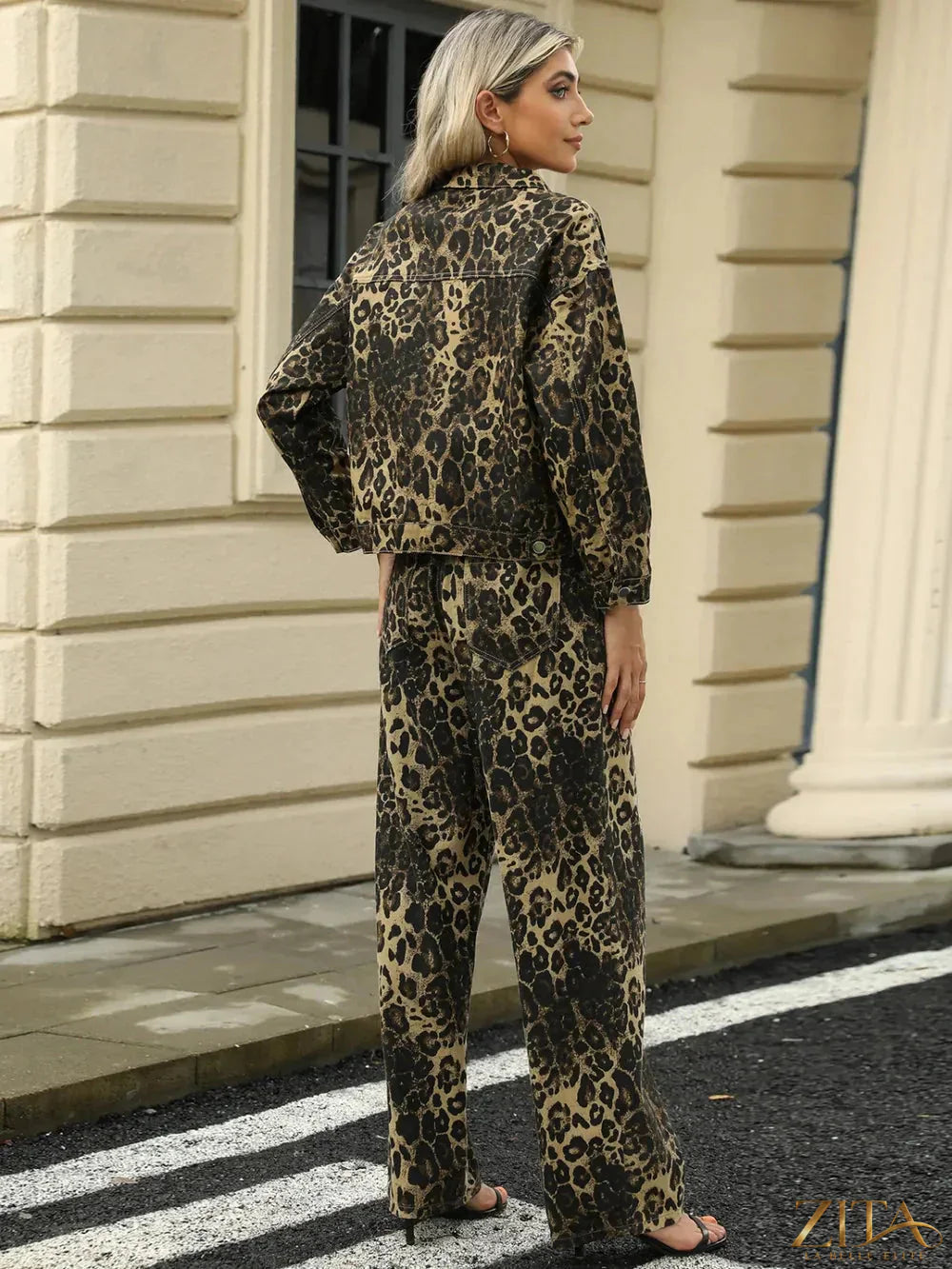 Zita La Belle Elite pocketed leopard print long sleeve denim jacket with front pockets and button closure.