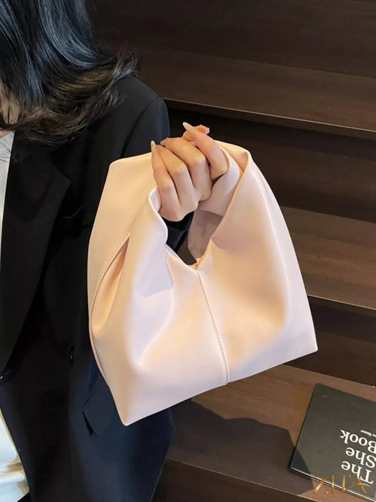Zita La Belle Elite knot handle leather handbag with top zipper and stylish design, featuring a smooth leather finish.