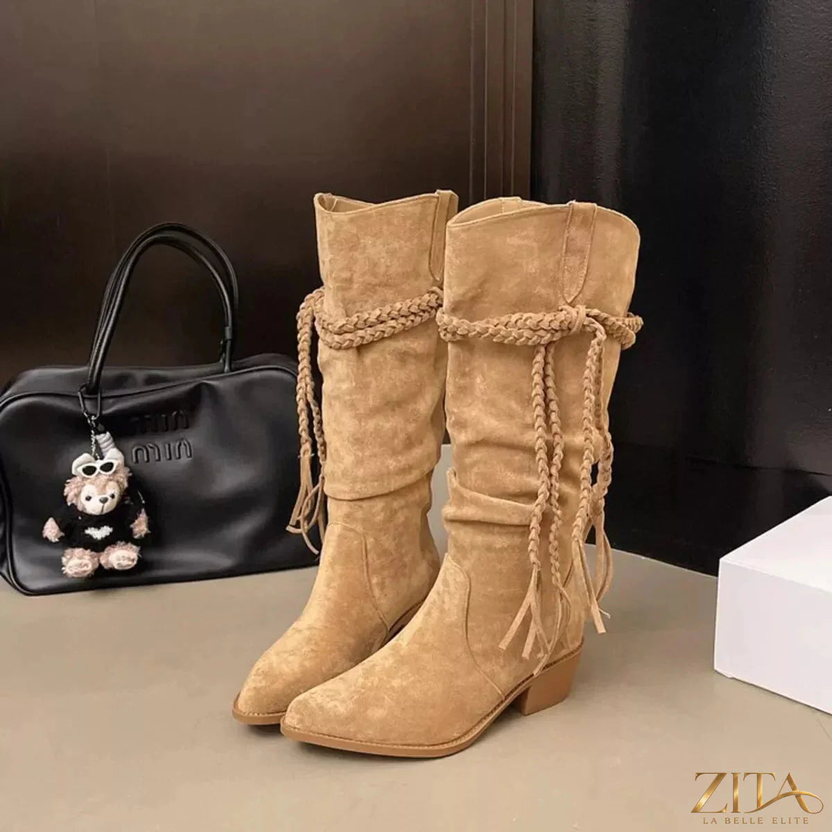 Zita La Belle Elite point toe block heel boots featuring sleek design, black leather, and sturdy block heels for stylish elegance.
