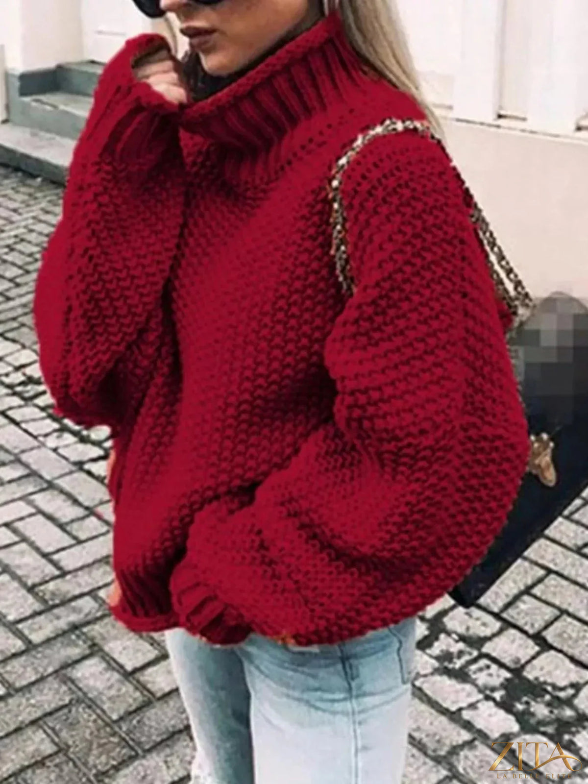 Zita La Belle Elite chunky knit turtleneck sweater in cream with thick ribbed collar and cozy textured fabric.
