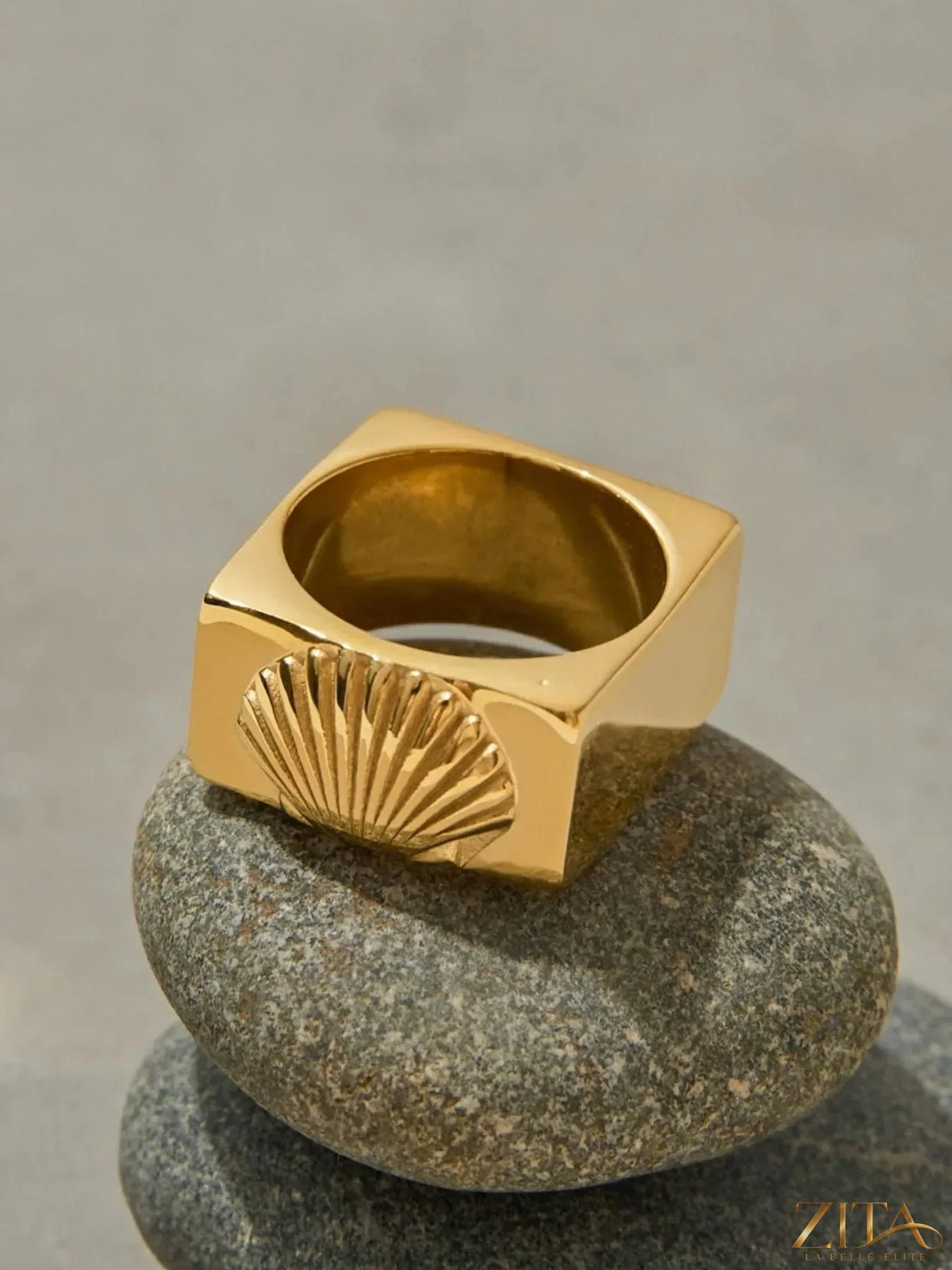Vintage shell pattern gold signet ring by Zita La Belle Elite, featuring intricate shell design on a polished gold band.