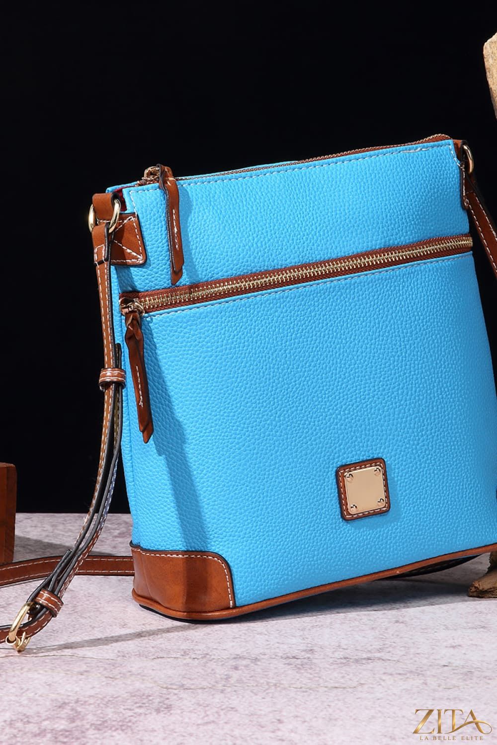 Zita La Belle Elite PU leather crossbody bag with adjustable strap, showing sleek black design and gold-tone hardware.