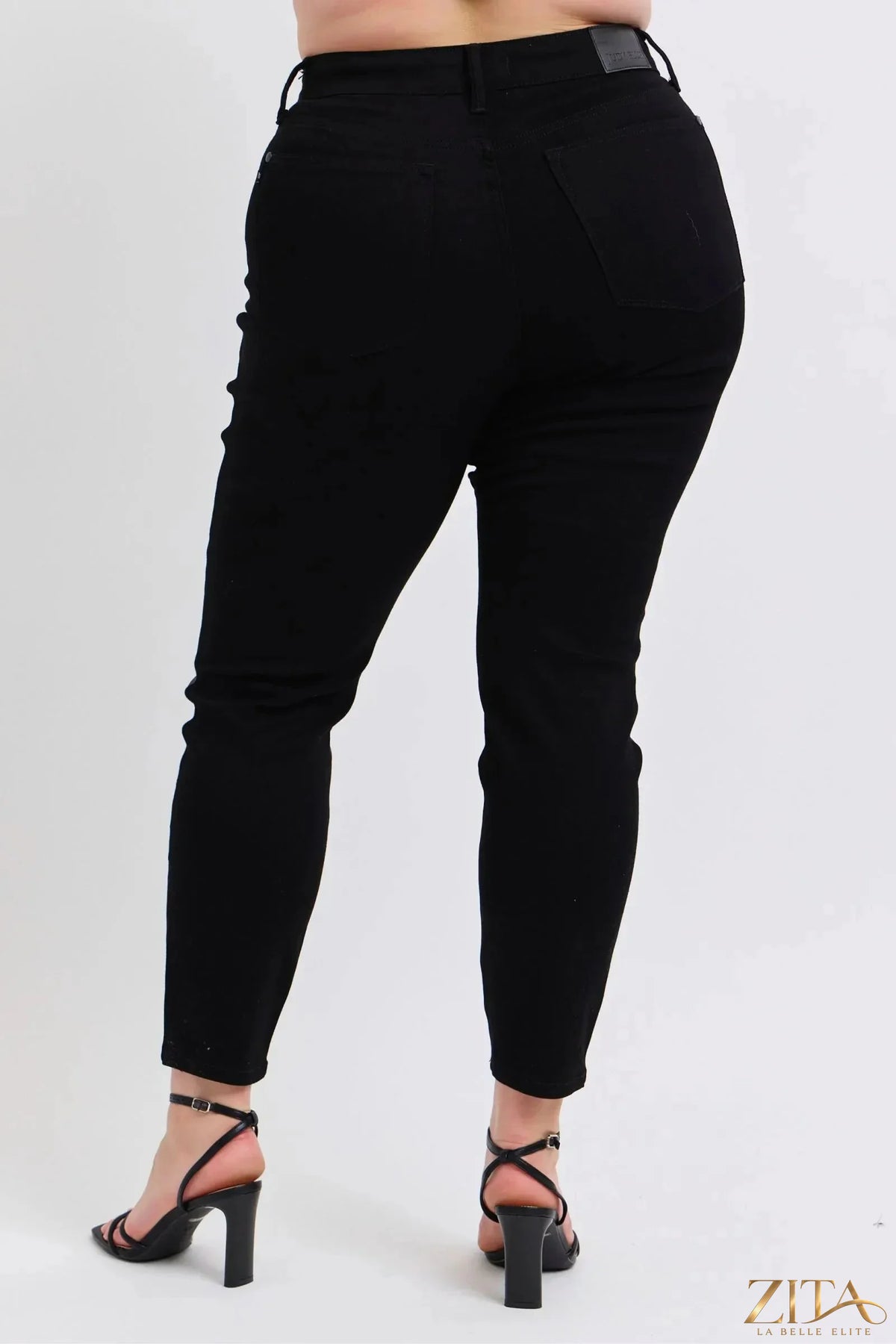 Plus size faux leather skinny pants by Judy Blue, featuring a sleek black design and fitted silhouette, from Zita La Belle Elite.