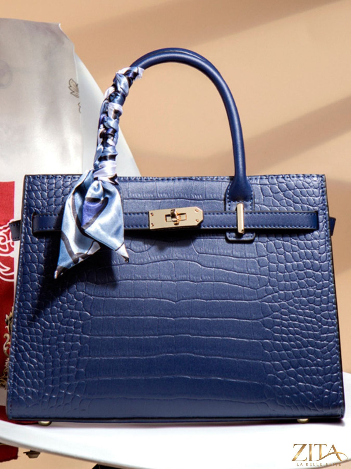 Zita La Belle Elite crocodile embossed leather top handle handbag with gold-tone hardware and structured design.