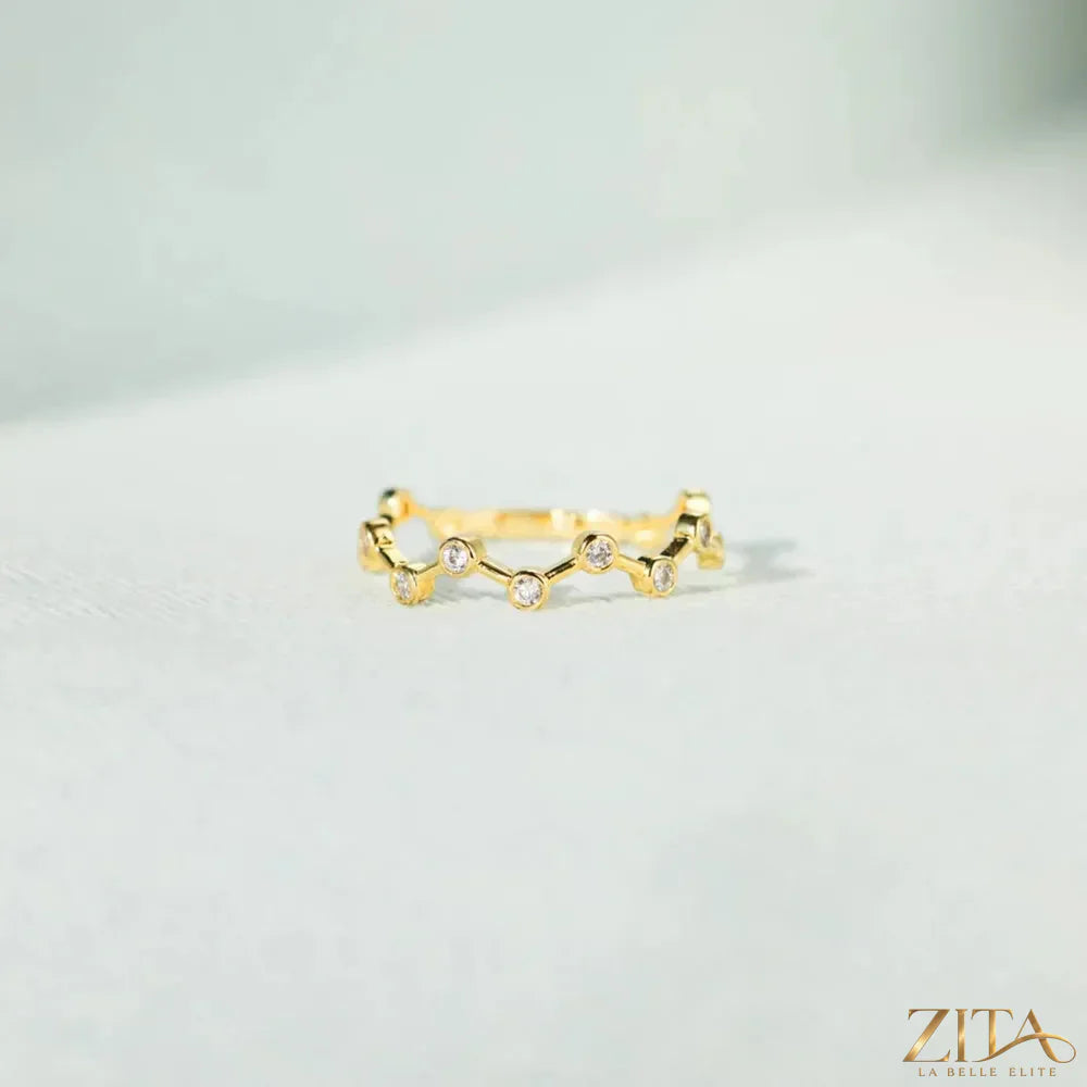 18K gold-plated sterling silver zircon ring by Zita La Belle Elite, featuring a sparkling zircon gemstone and intricate band details.