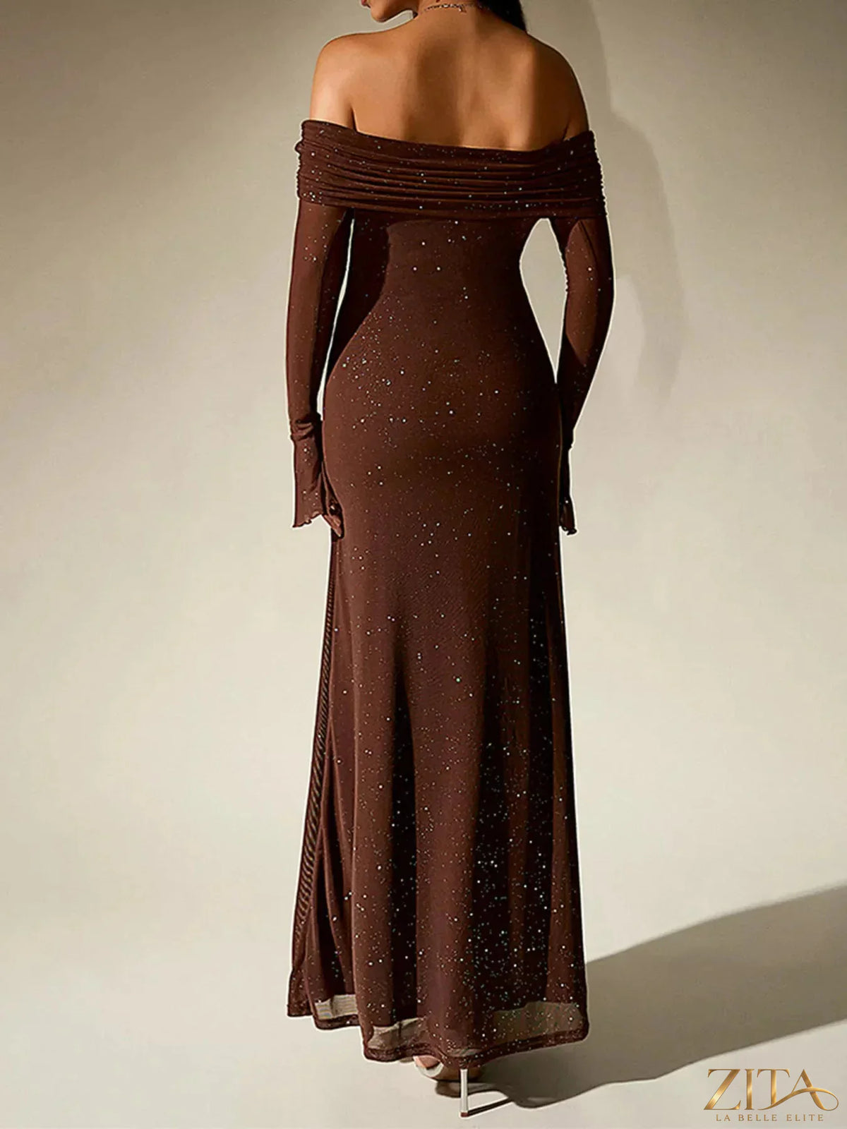 Zita La Belle Elite glitter off-shoulder maxi dress with flowing fabric and shimmering details, perfect for elegant evening wear.