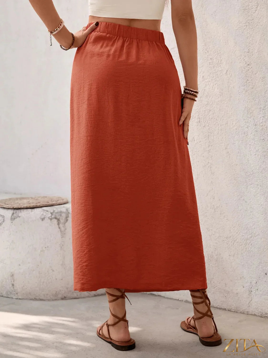 Zita La Belle Elite slit midi skirt in black with side slit, flowing fabric, stylish and elegant for versatile fashion looks.