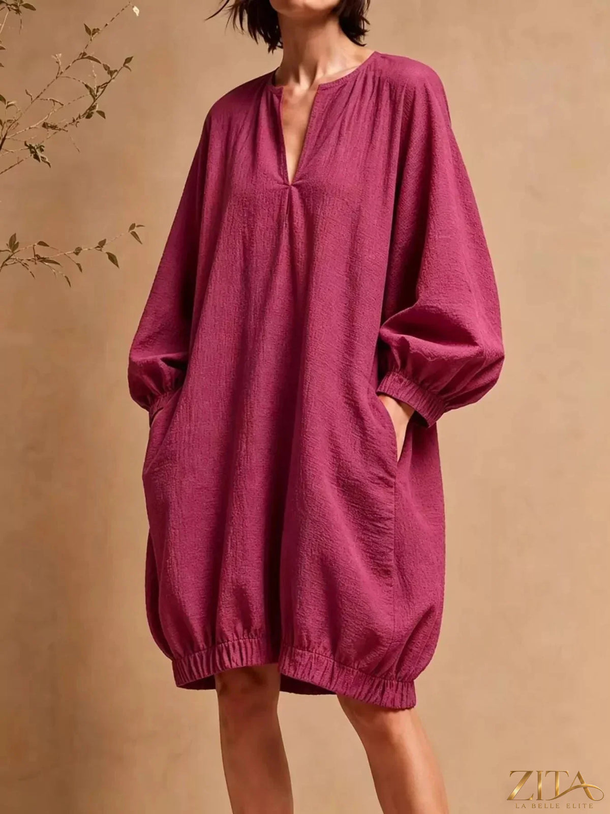 Casual loose-fit balloon sleeve mini dress with pockets by Zita La Belle Elite, featuring a relaxed silhouette and stylish design.