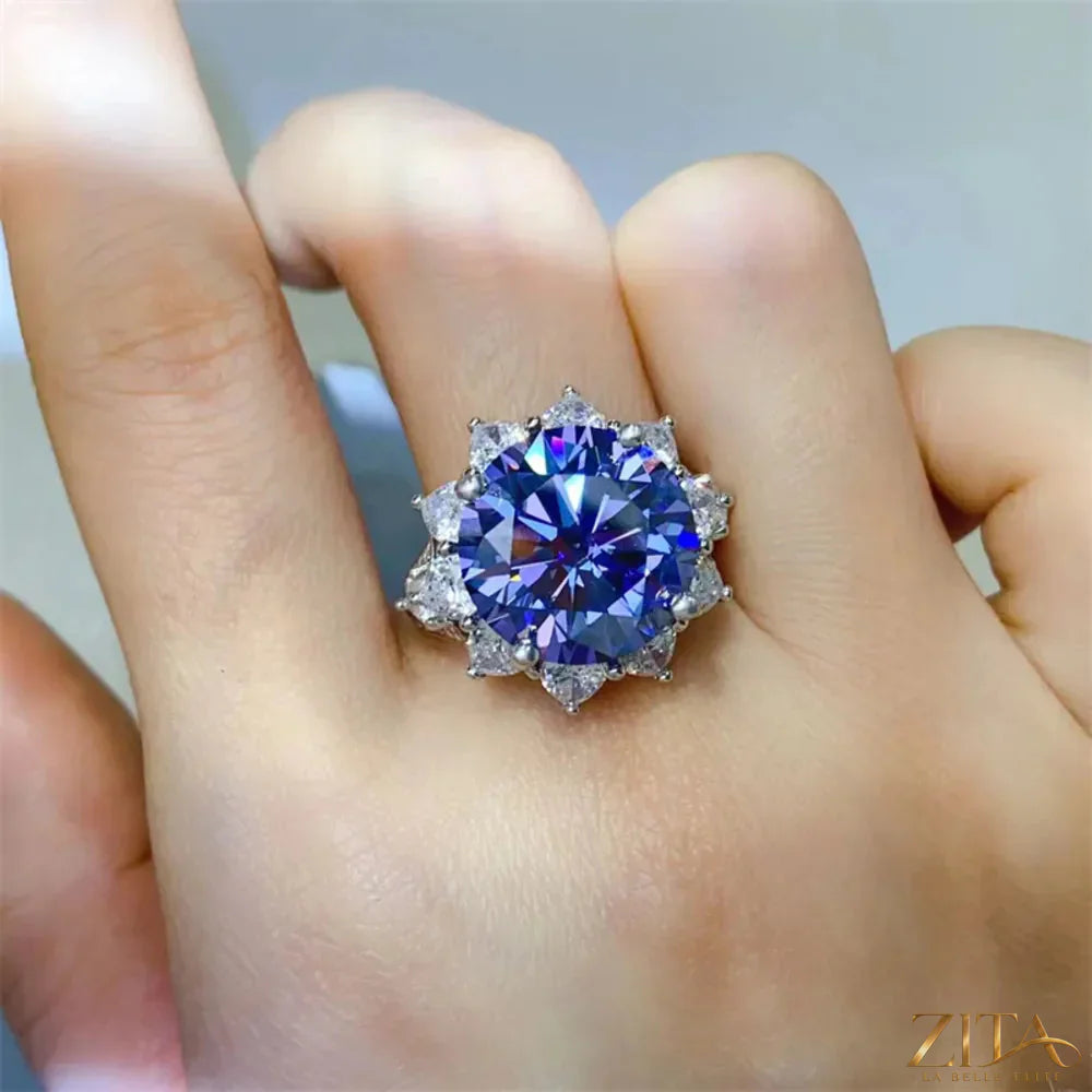 Sterling silver ring with a 10-carat moissanite gemstone, elegant jewelry piece with a polished finish and intricate band design.