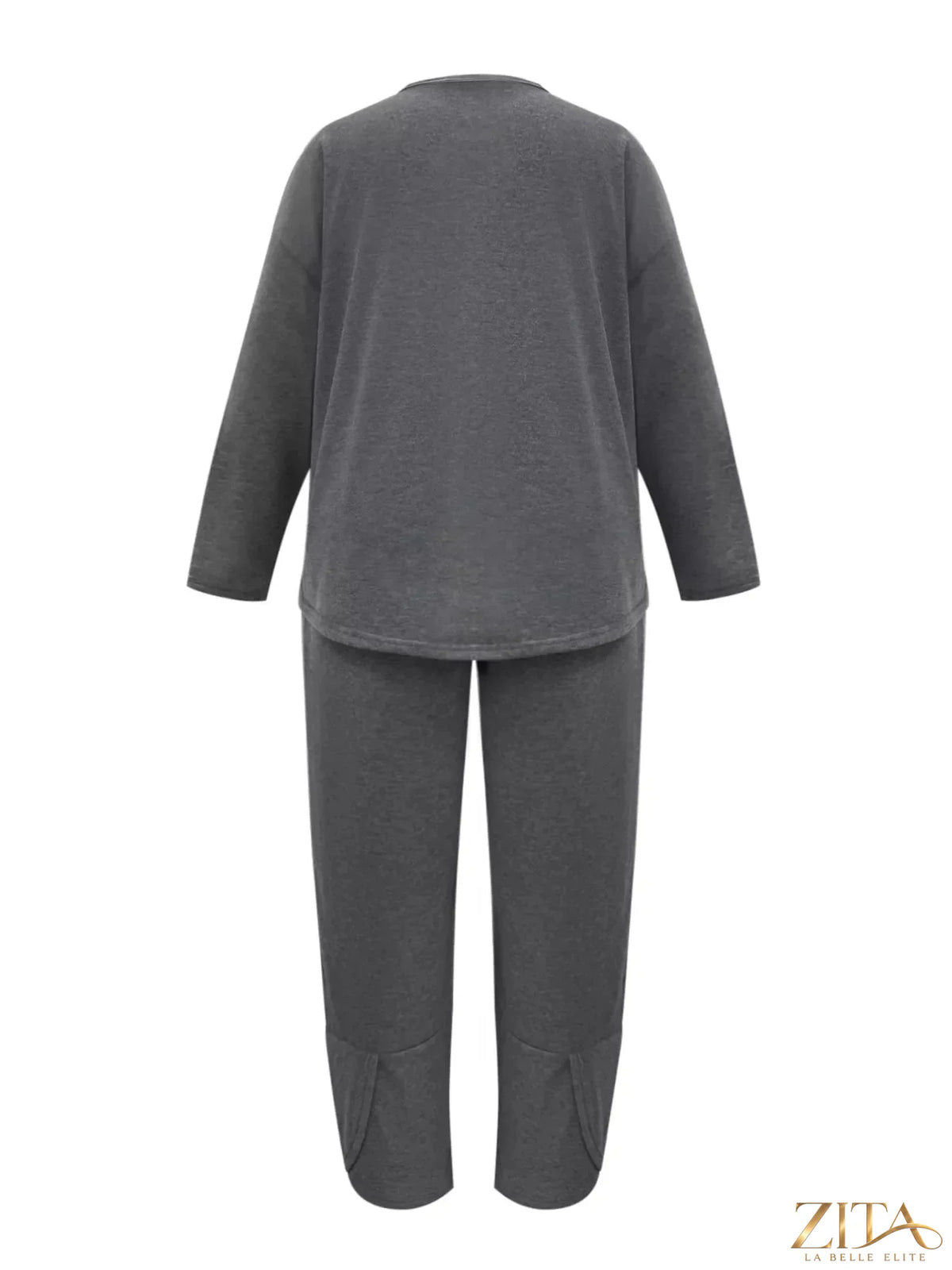 Plus size casual loose fit top and pants two-piece set by Trendsi, featuring comfortable, stylish matching outfit in soft fabric.
