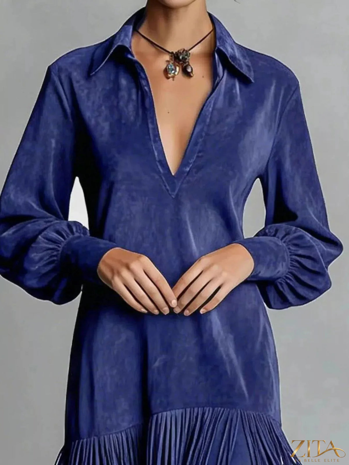 Trendsi fringed lantern sleeve dress featuring flowy fabric and stylish fringe details on sleeves, perfect for casual or semi-formal wear.