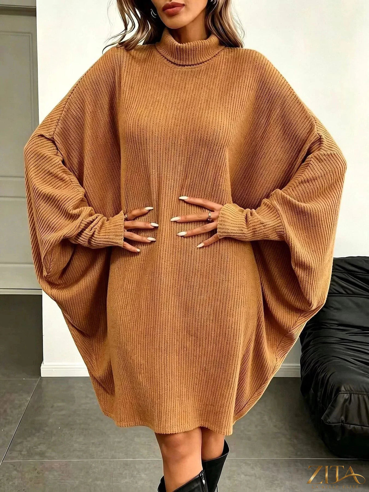 Zita La Belle Elite oversized batwing sleeve ribbed knit turtleneck dress displayed on a model, showcasing its relaxed fit and textured fabric.