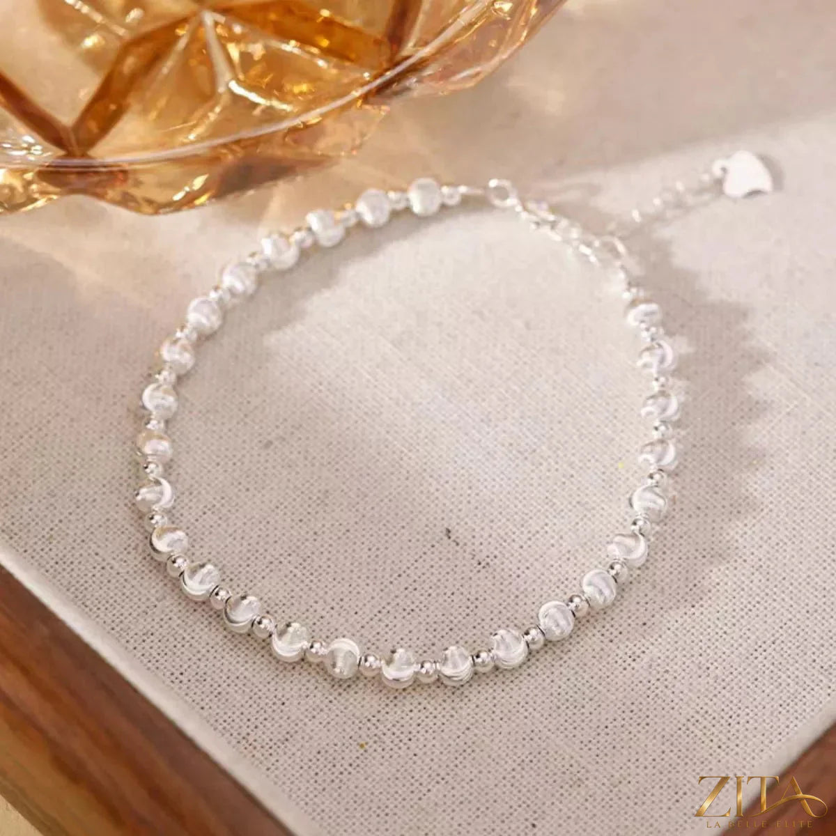 Sterling silver beaded bracelet with round beads, stylish jewelry from Trendsi featuring a sleek, polished finish.