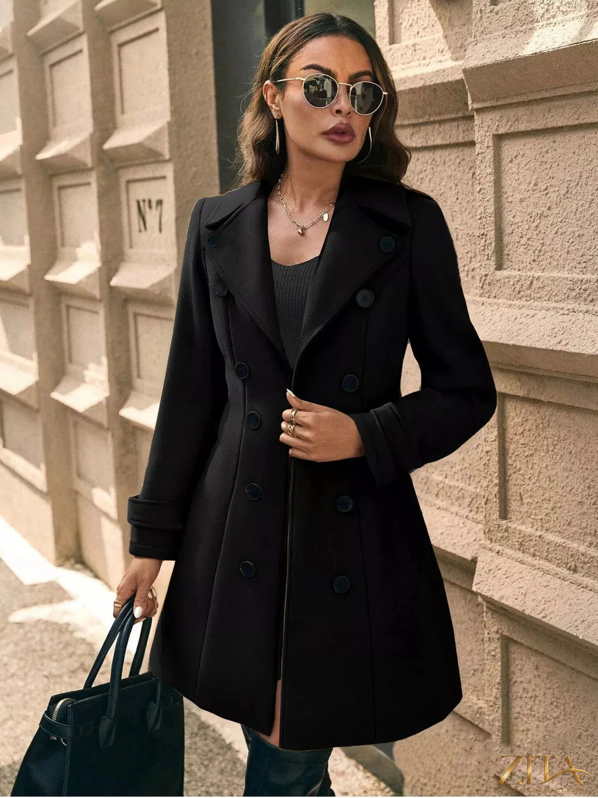 Zita La Belle Elite double-breasted wool blend overcoat displayed on a hanger, showcasing its classic tailored design and textured fabric.
