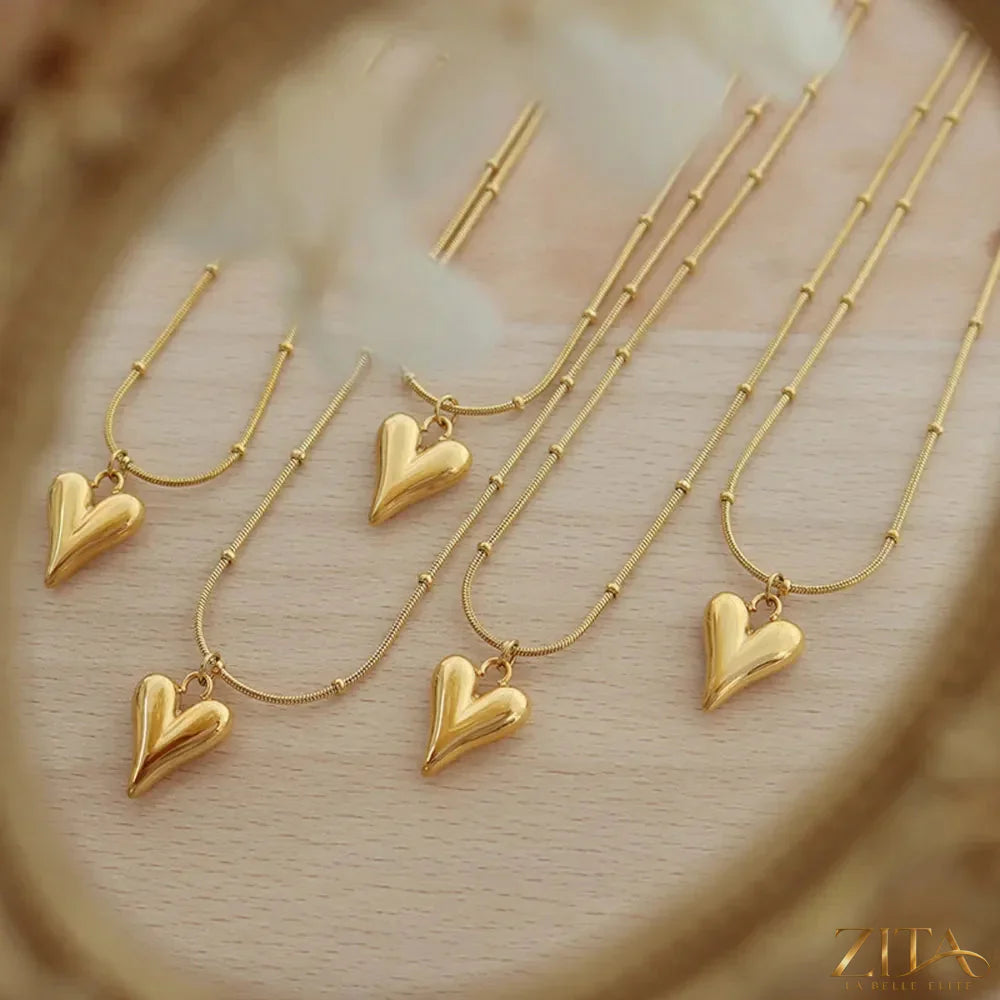 Titanium steel heart pendant necklace with polished finish, featuring a sleek and elegant design by Zita La Belle Elite.
