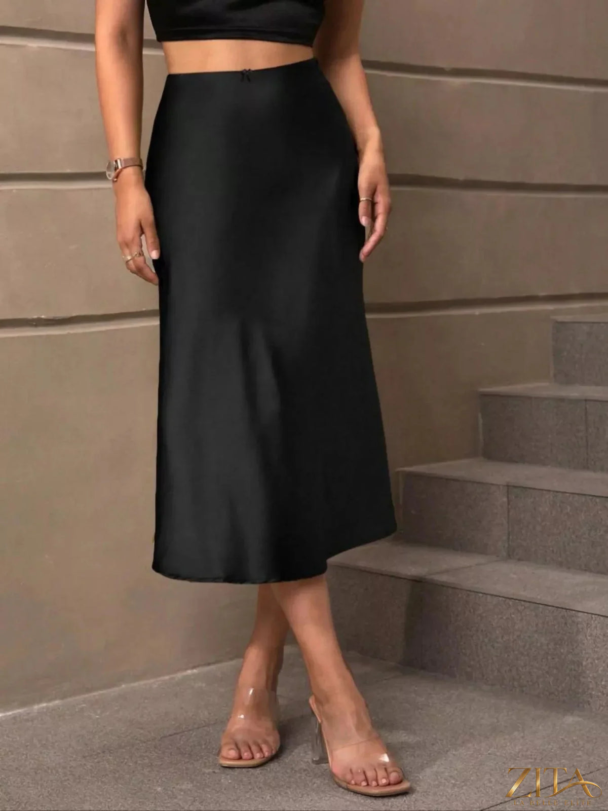 Satin midi skirt by Trendsi featuring a smooth, shiny fabric and a flowing silhouette, displayed on a neutral background.