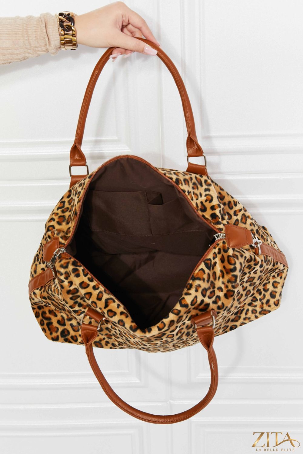 Zita La Belle Elite animal print brushed weekender bag with black handles and zipper, featuring a stylish zebra pattern for travel.