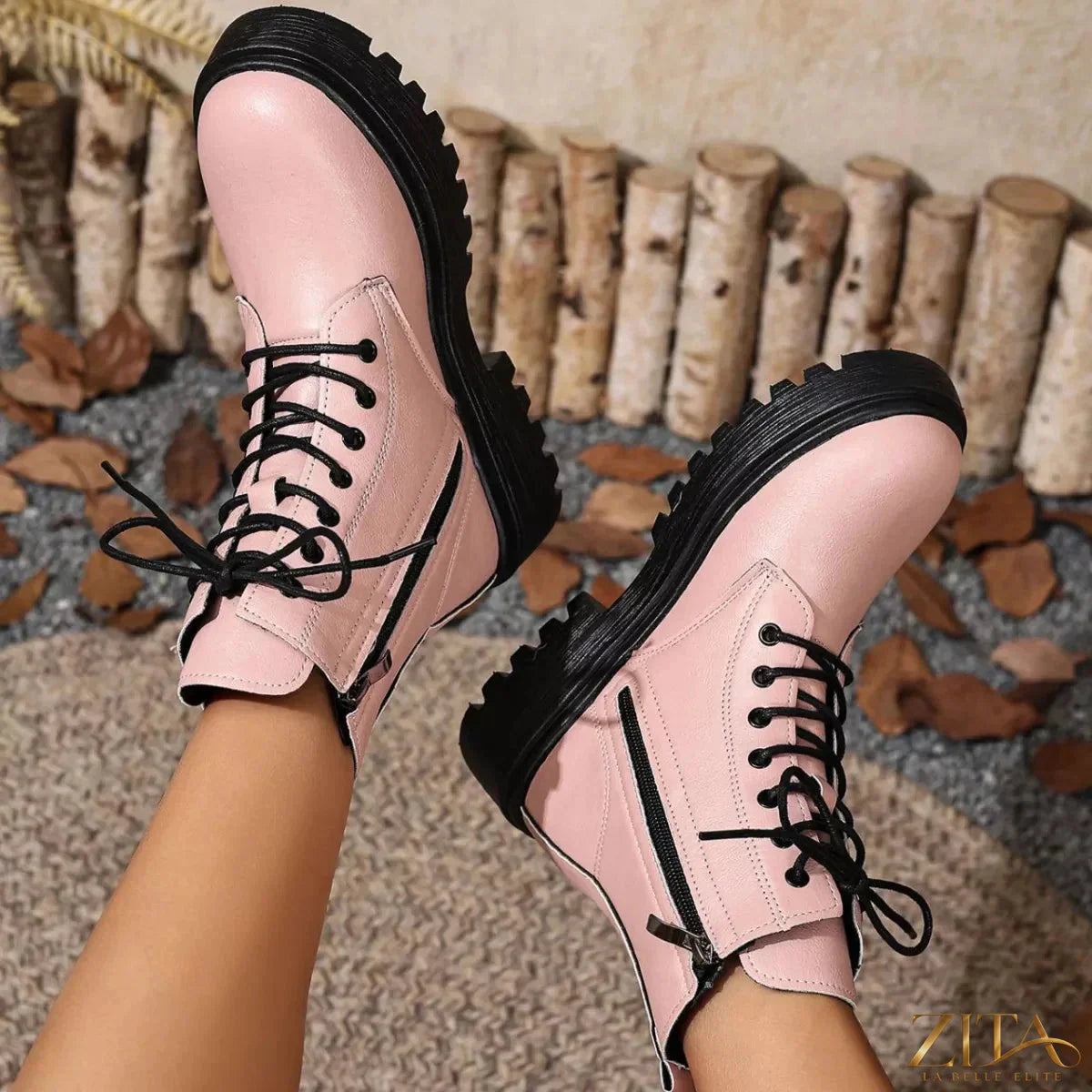 Zita La Belle Elite lace-up ankle combat boots with chunky soles and metal eyelets, styled with casual denim jeans.