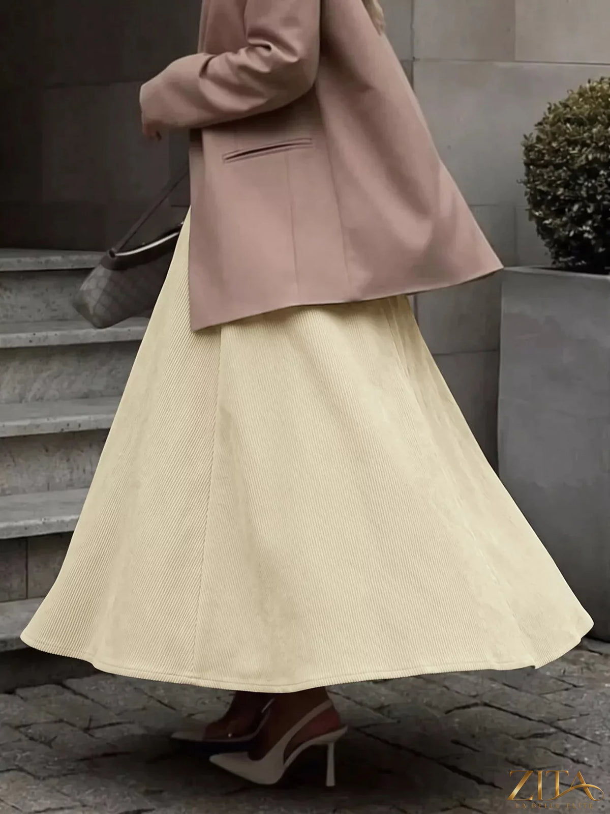 Zita La Belle Elite high waist pleated midi skirt in flowy fabric, shown in a stylish, elegant design.