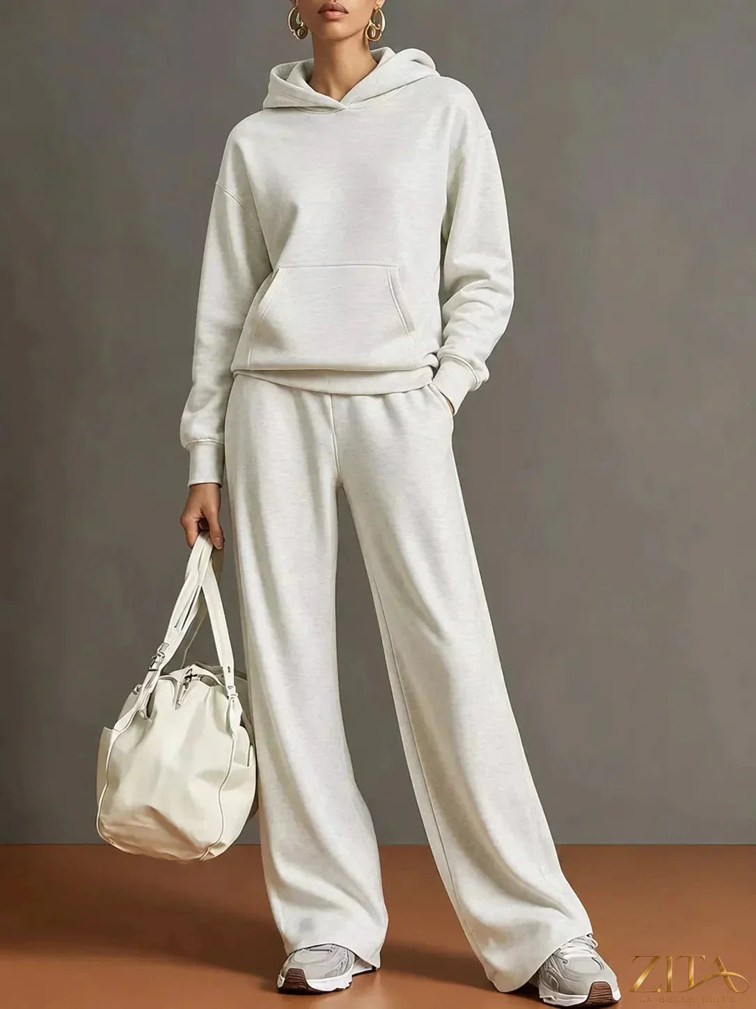 Zita La Belle Elite kangaroo pocket hoodie and pants set in soft fabric, featuring a cozy hood and relaxed fit for casual wear.