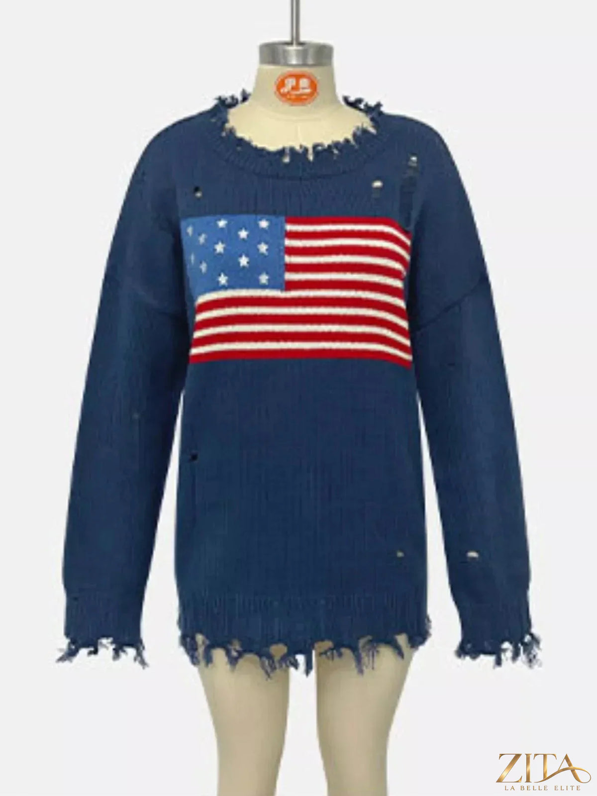 Distressed American flag graphic sweater by Trendsi showing a cozy knit sweater with a patriotic flag design and a worn, vintage look.
