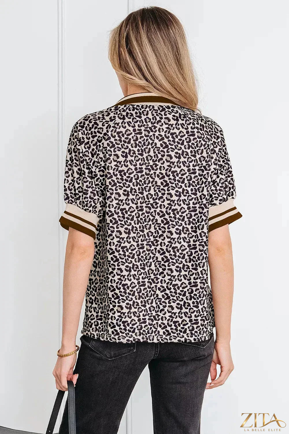 Leopard print half zip blouse from Zita La Belle Elite, featuring a stylish collar and relaxed fit, displayed on a white background.