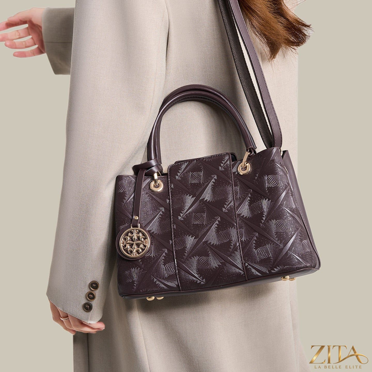 Zita La Belle Elite embossed pattern leather top handle handbag with textured surface and elegant design.