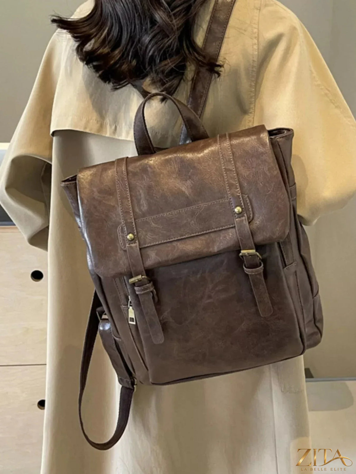 Leather flap backpack bag from Trendsi with adjustable straps and spacious main compartment, designed for stylish everyday use.
