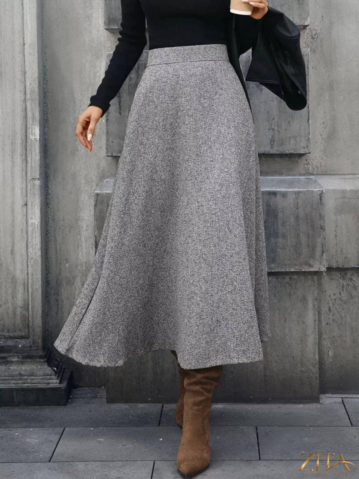 Trendsi A-line midi skirt in soft fabric, shown in a stylish, flowy design perfect for casual or dressy occasions.