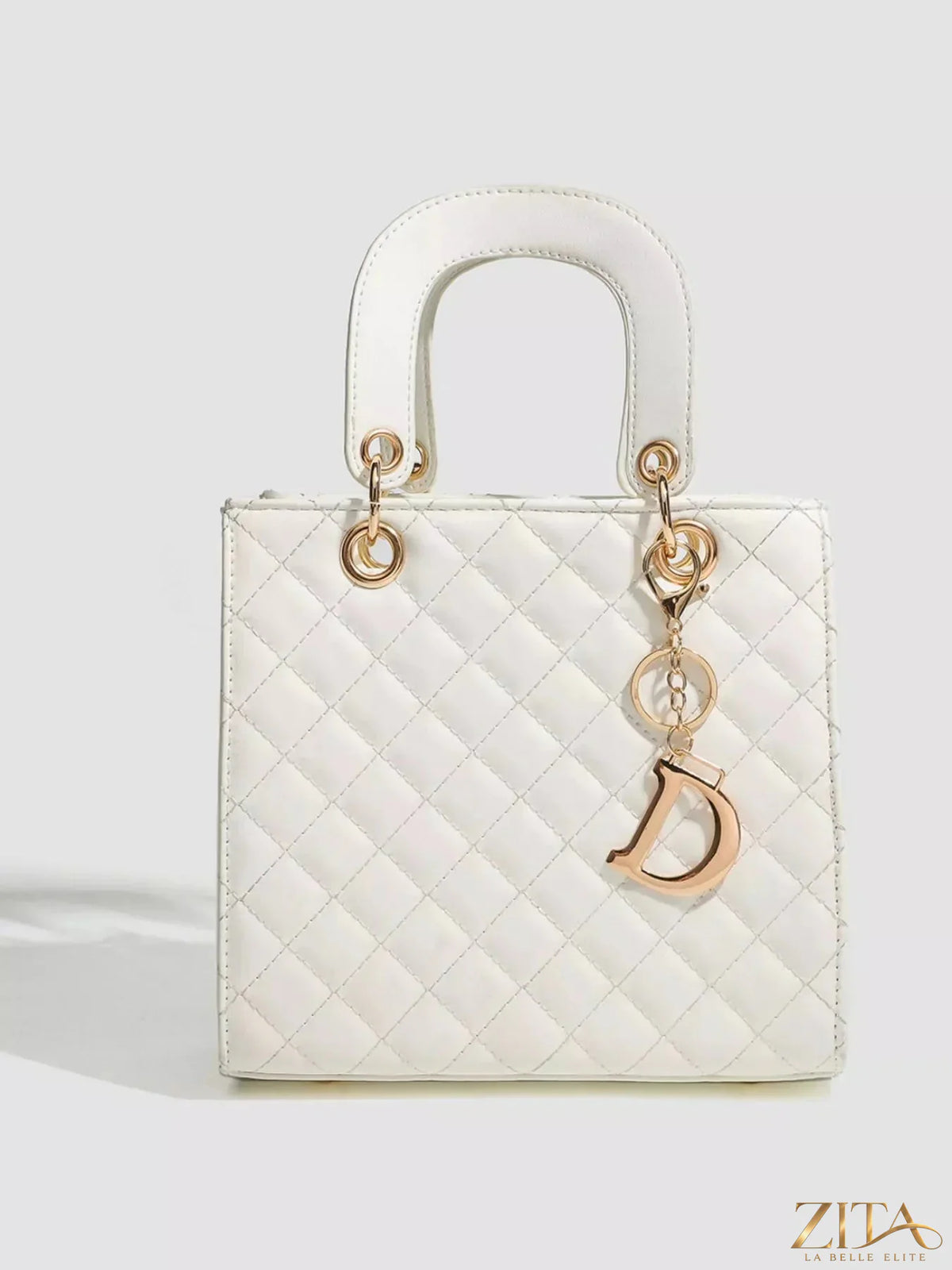 Zita La Belle Elite quilted top handle handbag with gold-tone hardware and structured design, featuring a sleek black leather finish.