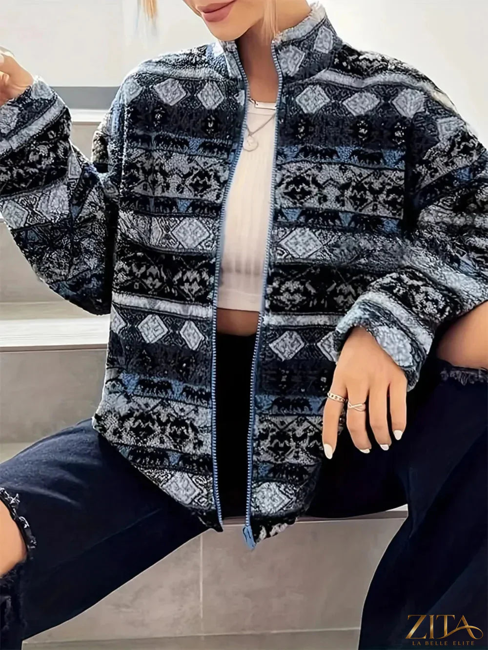Zita La Belle Elite geometric turtleneck zip-up jacket with bold pattern and fitted design, shown on a mannequin.