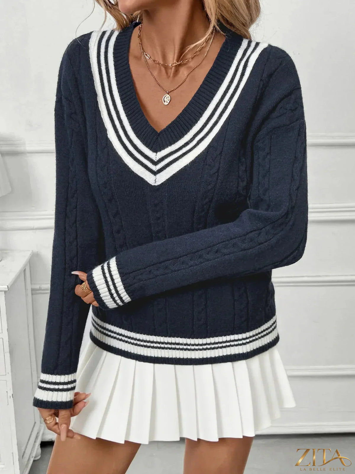 Zita La Belle Elite contrast striped V-neck sweater featuring bold black and white horizontal stripes and a relaxed fit.