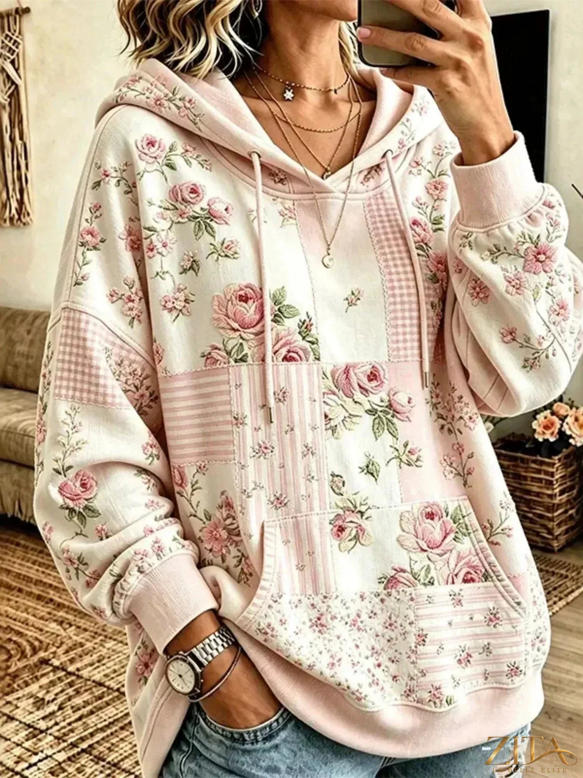 Plus size floral dropped shoulder hoodie with drawstring from Zita La Belle Elite, featuring a relaxed fit and vibrant floral pattern.