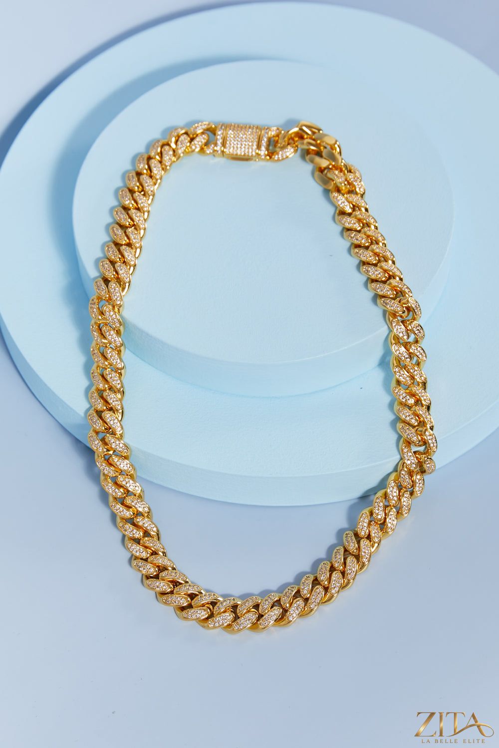 Brass curb chain necklace with interlocking oval links, stylish jewelry piece, featuring a polished gold-tone finish.