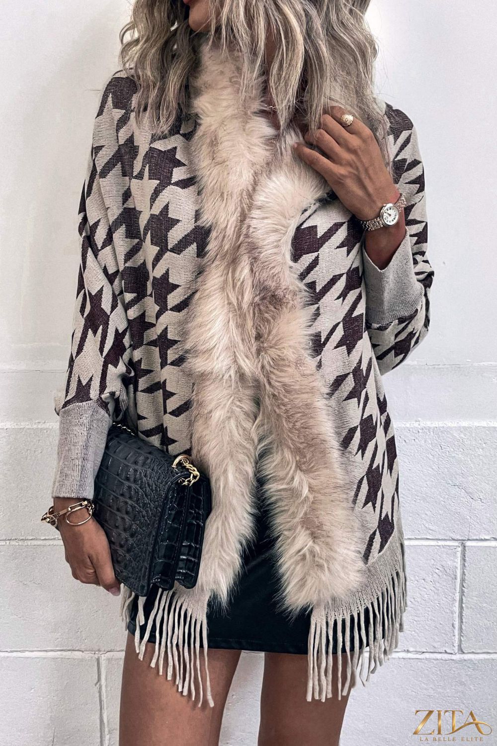 Houndstooth fringe-hem poncho in black and white with stylish fringe details, designed by Trendsi.