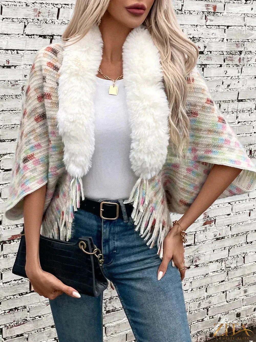 Fuzzy open front fringe poncho in neutral tones, featuring a cozy, textured design and stylish fringe detailing from Trendsi.
