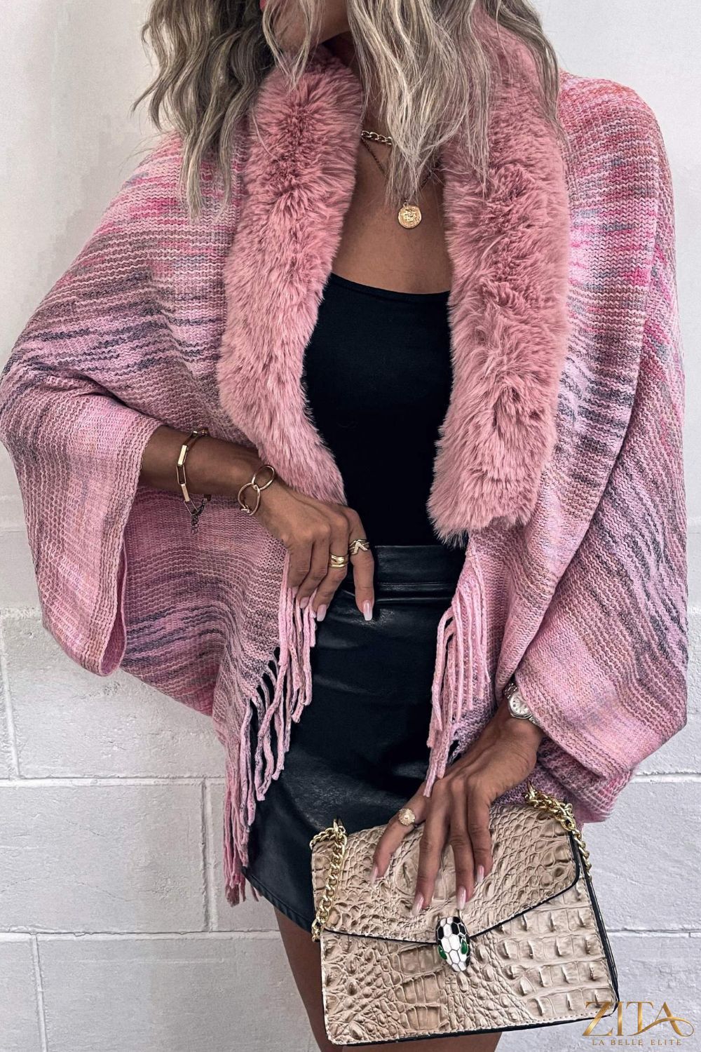 Open front fringe hem poncho from Trendsi, featuring a flowy design with fringe details and an open front style.