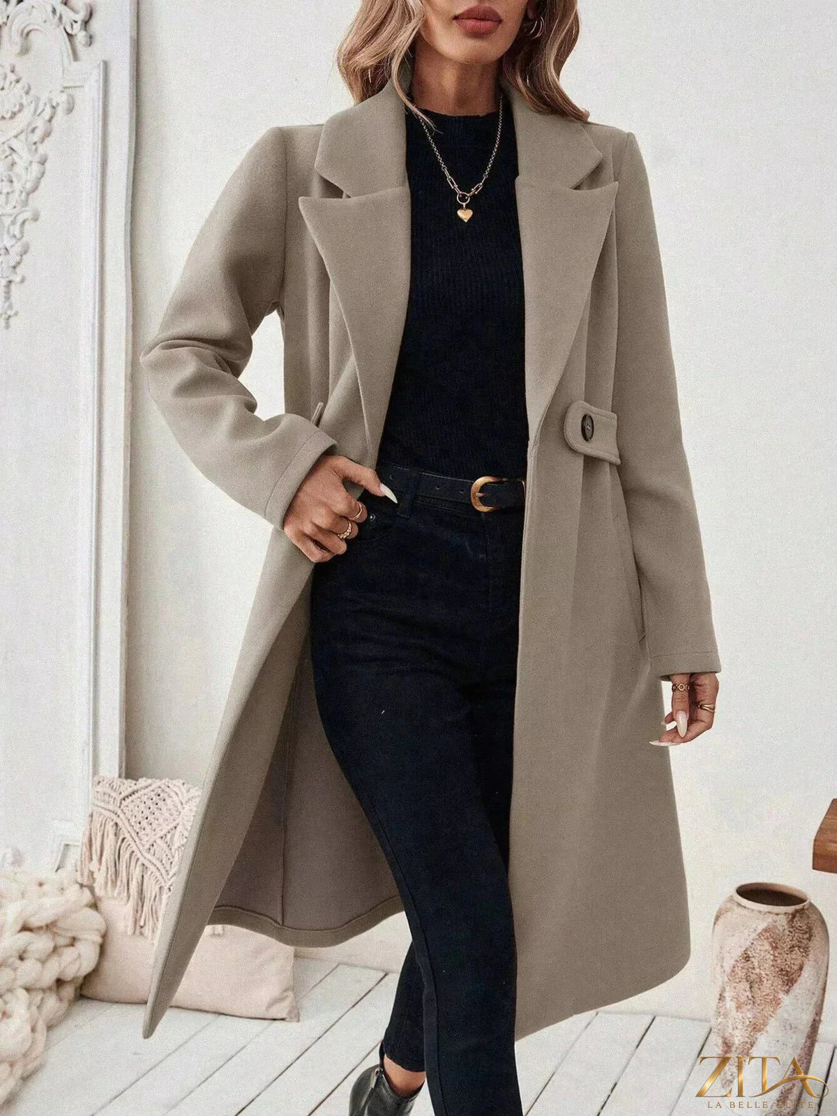 Zita La Belle Elite one-button lapel collar overcoat on a hanger, showcasing classic design and tailored fit in neutral fabric.