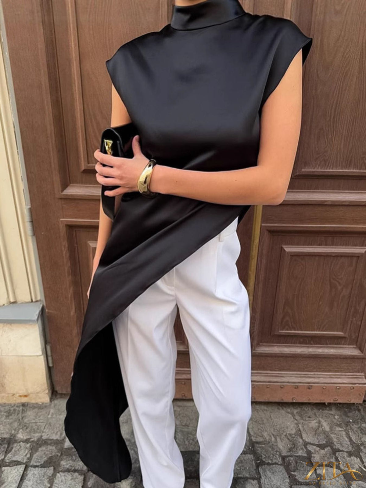 Zita La Belle Elite asymmetrical hem turtleneck blouse in soft fabric, featuring a stylish high neckline and unique hem detail.