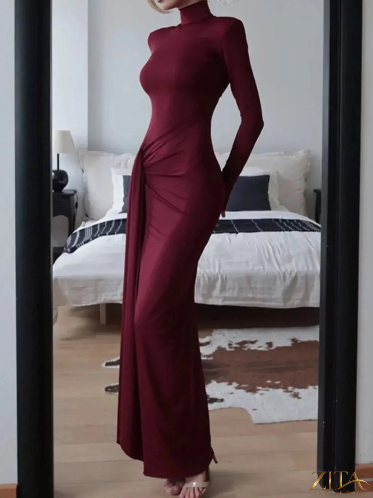 Black turtleneck long sleeve slit maxi dress by Trendsi, flowing fabric with slit detail, perfect for elegant, stylish occasions.