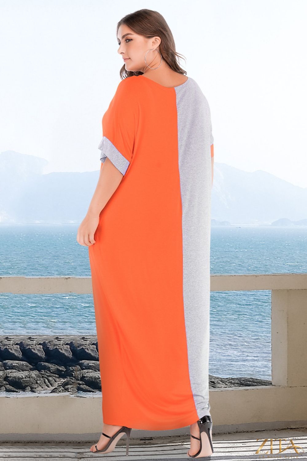 Plus size color block tee dress with pockets by Trendsi, featuring a relaxed fit and vibrant color blocking design.