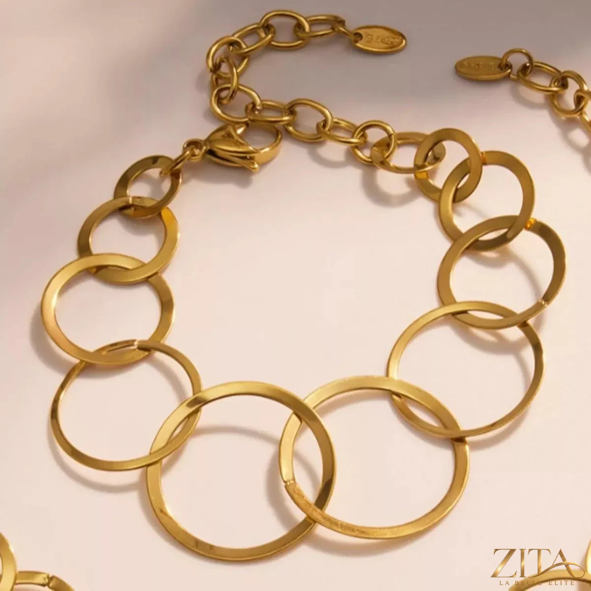 18K gold-plated titanium steel round bracelet by Zita La Belle Elite, featuring sleek, polished design with a smooth circular band.
