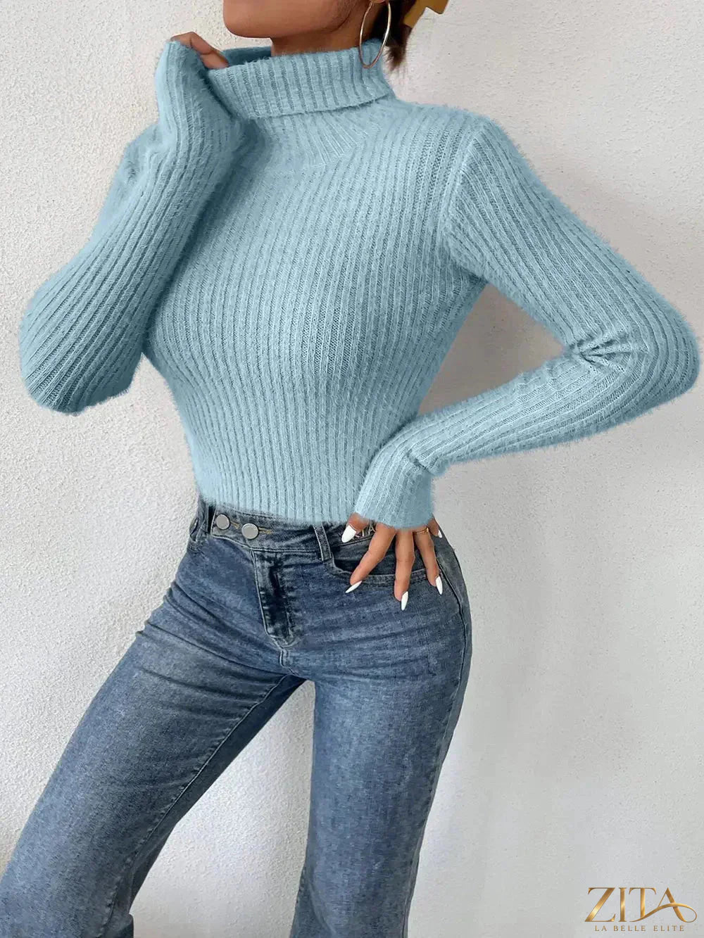 Ribbed turtleneck long sleeve sweater by Trendsi, featuring a fitted design and soft knit texture in a neutral color.