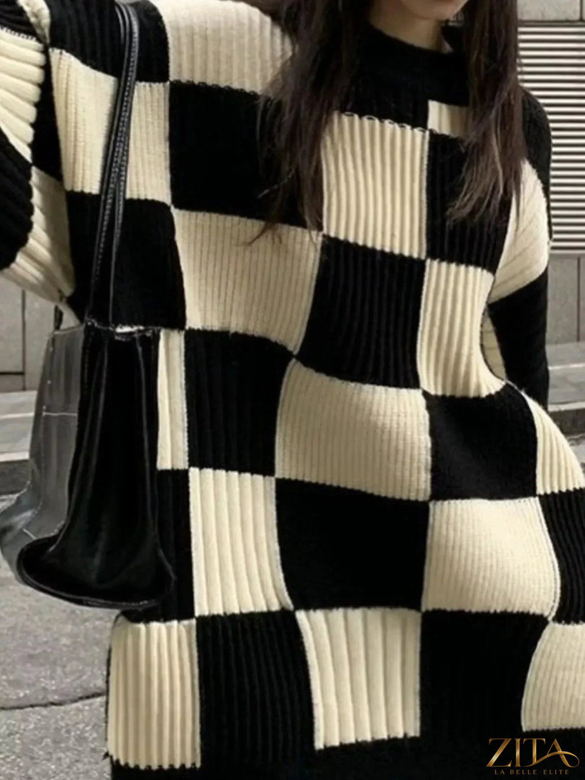 Zita La Belle Elite oversized checkerboard pattern sweater in black and white, showcasing its chunky knit and relaxed fit.