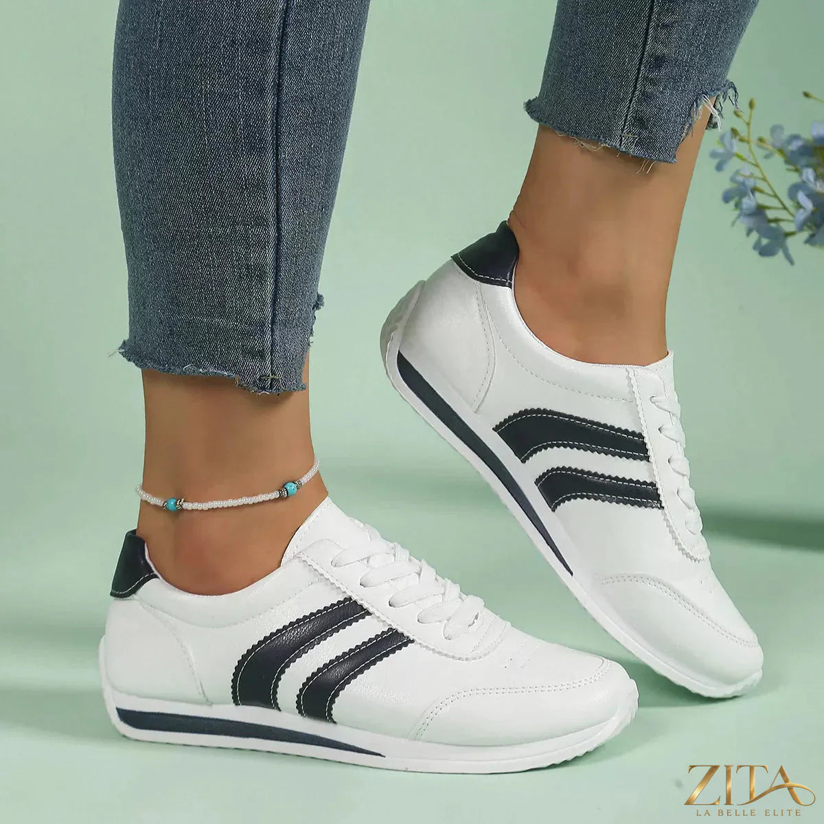 Zita La Belle Elite round toe lace-up sneakers in white, showcasing stylish design and comfortable fit with white laces and rubber sole.