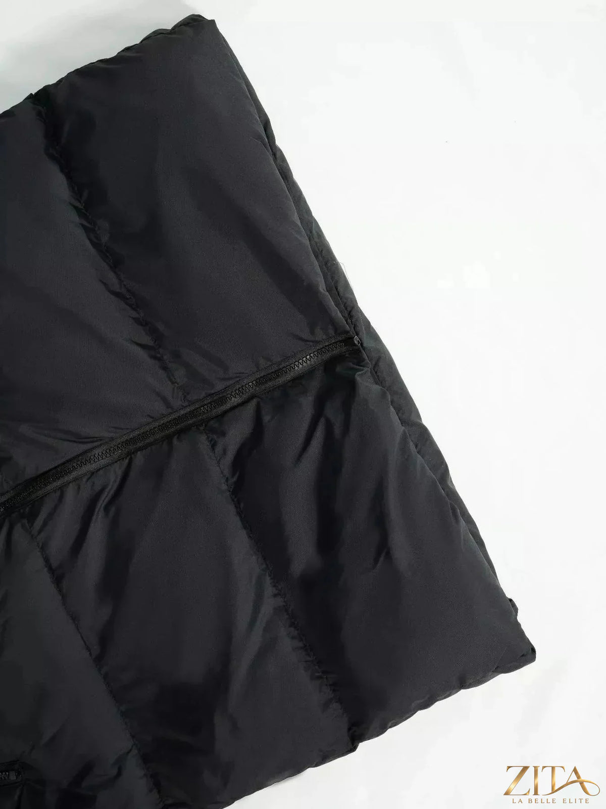 Longline padded hooded vest coat by Zita La Belle Elite, featuring a warm insulated design and a stylish long silhouette.