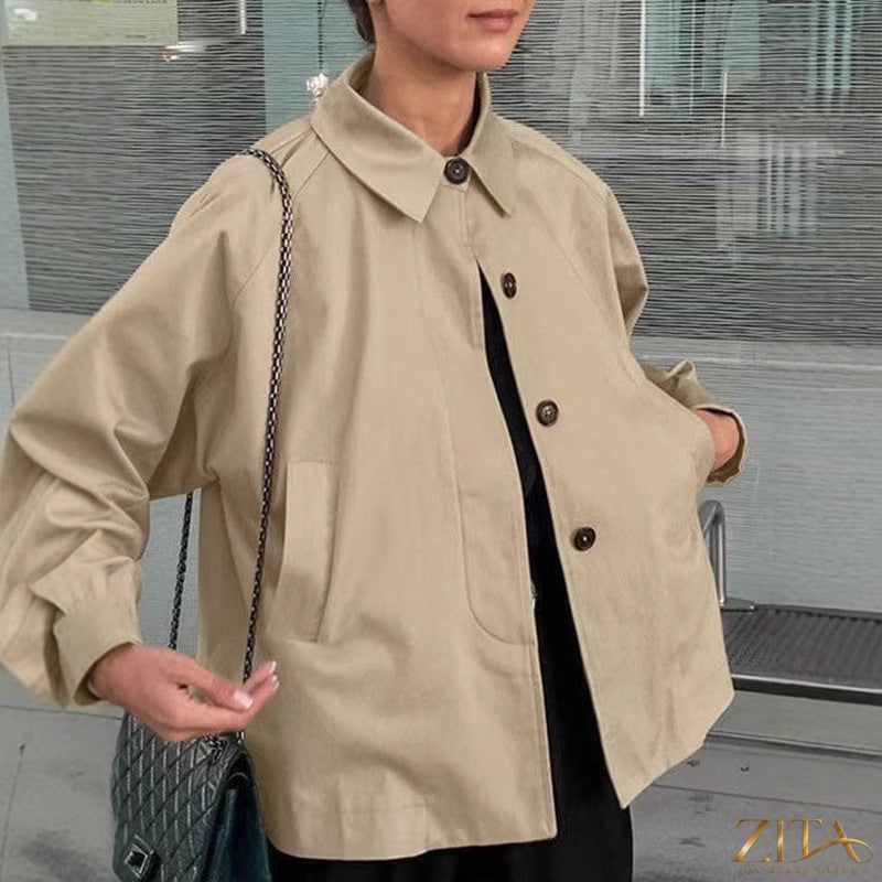 Women’s French-style loose mid-length trench coat by Zita La Belle Elite, showcasing classic beige fabric and stylish workwear design.